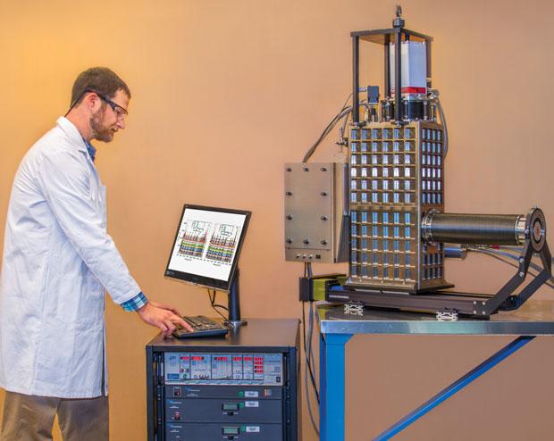 STJ x-ray spectrometer (shown on the table) to characterize a material sample.