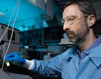 LLNL biologist Nicholas Fischer is analyzing the size of the nanolipoprotein particles (NLPs) by dynamic light scattering in preparation for their use in vaccine applications. Fischer and two former LLNL researchers are key developers of the NLP technology. Photo by Blaise Douros