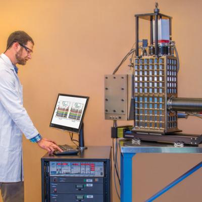 STJ x-ray spectrometer (shown on the table) to characterize a material sample.