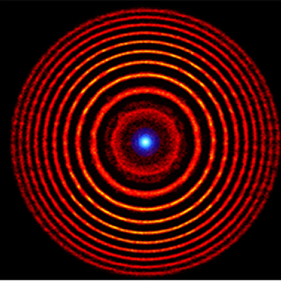Colorized illustration from a simulation of a holographic plasma lens. The red concentric circles denote alternating high- and low-density plasma rings. The blue dot at the center represents the focused light. Image by Matthew Edwards/LLNL