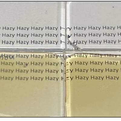 Comparative photos of LLNL metal oxide nanoparticle (MONPs) loaded optical adhesive formulations vs commercial offerings using the same MONPs (~1 mm thick films).