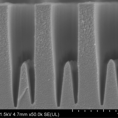 Fabrication of height modulated and tapered features in fused silica
